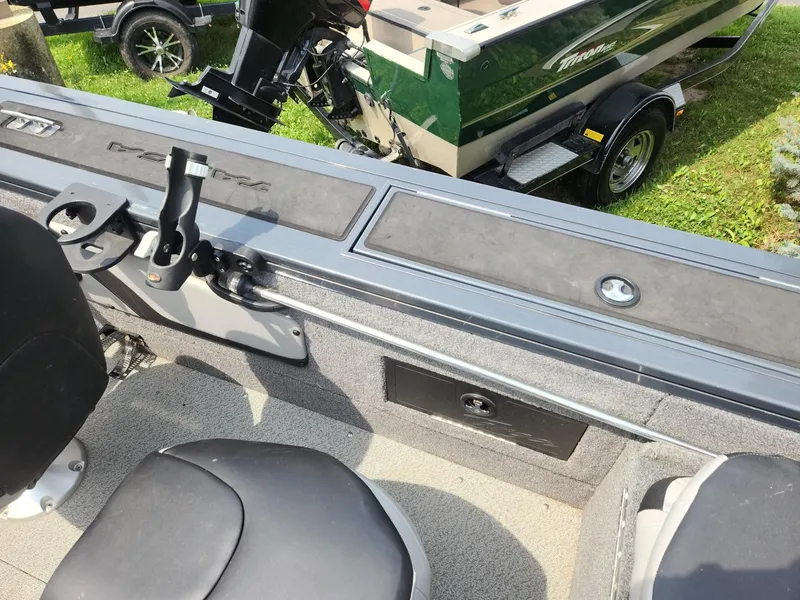Slide: The Image of 2019 Tracker Targa V-18 Combo boat interior with seating and rod holder. - 14