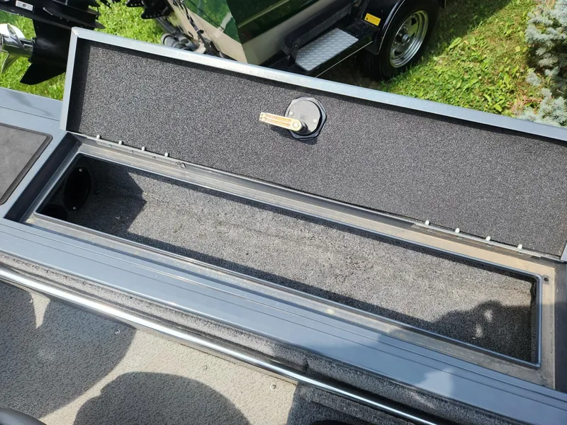 Slide: The Image of Open storage compartment on 2019 Tracker Targa V-18 Combo boat. - 15