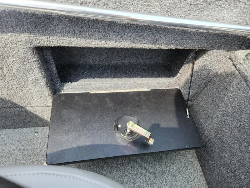 Slide: The Image of 2019 Tracker Targa V-18 Combo boat interior storage compartment with latch. - 20