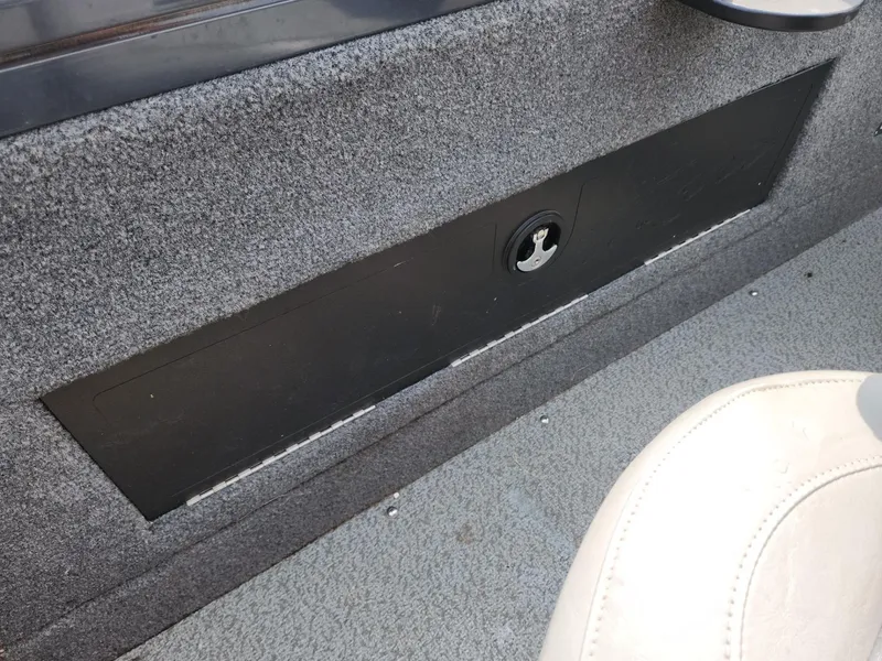 Slide: The Image of 2019 Tracker Targa V-18 Combo boat interior with storage compartment and seat. - 21