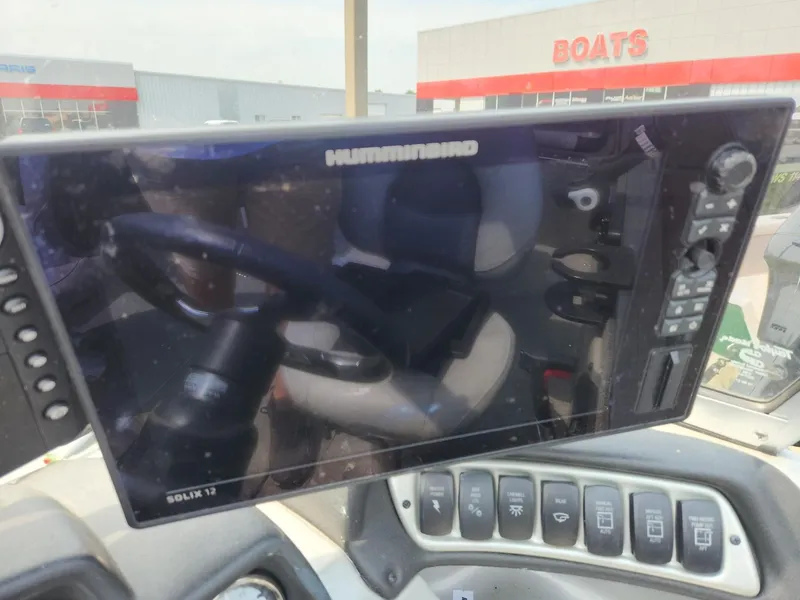 Slide: The Image of 2019 Tracker Targa V-18 Combo boat dashboard with Humminbird Solix 12 display. - 25