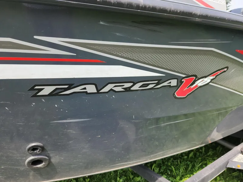 Slide: The Image of 2019 Tracker Targa V-18 Combo boat with sleek graphics and logo detail. - 36