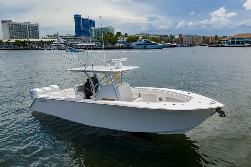 The Image of 2018 SeaHunter 33 Tournament boat on water, cityscape background. - 0