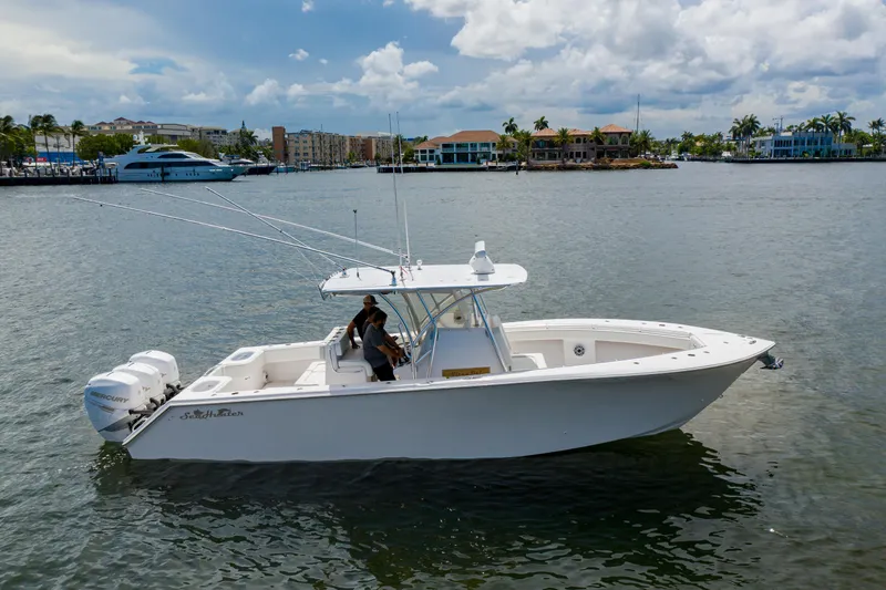 Slide: The Image of 2018 SeaHunter 33 Tournament boat on water, featuring dual Mercury engines. - 3