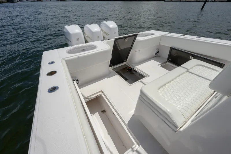 Slide: The Image of 2018 SeaHunter 33 Tournament boat interior with seating and storage compartments. - 9