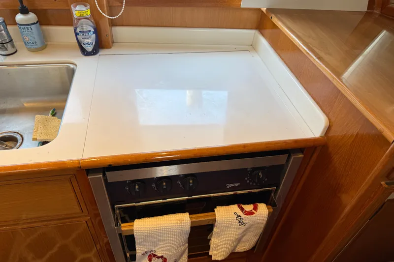 Slide: The Image of Galley kitchen in 2002 Grand Banks 42 Classic yacht with stove and sink. - 18