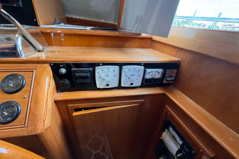 Slide: The Image of Control panel of 2002 Grand Banks 42 Classic yacht with gauges and switches. - 23