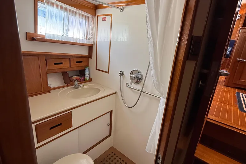 Slide: The Image of Bathroom interior of 2002 Grand Banks 42 Classic yacht, featuring sink and shower. - 32