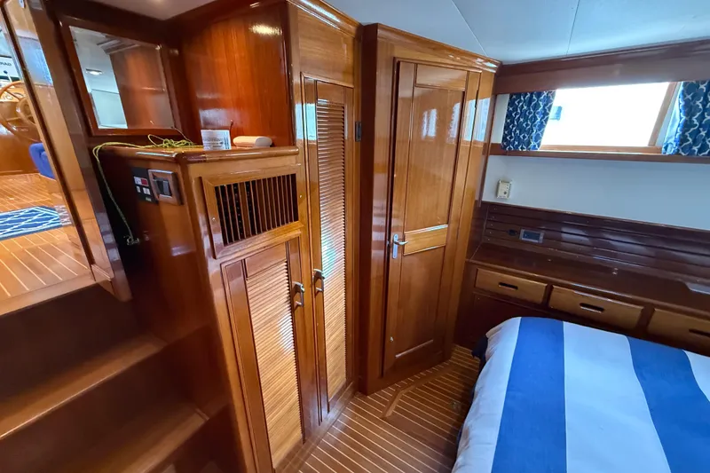 Slide: The Image of Luxurious wooden interior of 2002 Grand Banks 42 Classic yacht cabin. - 35