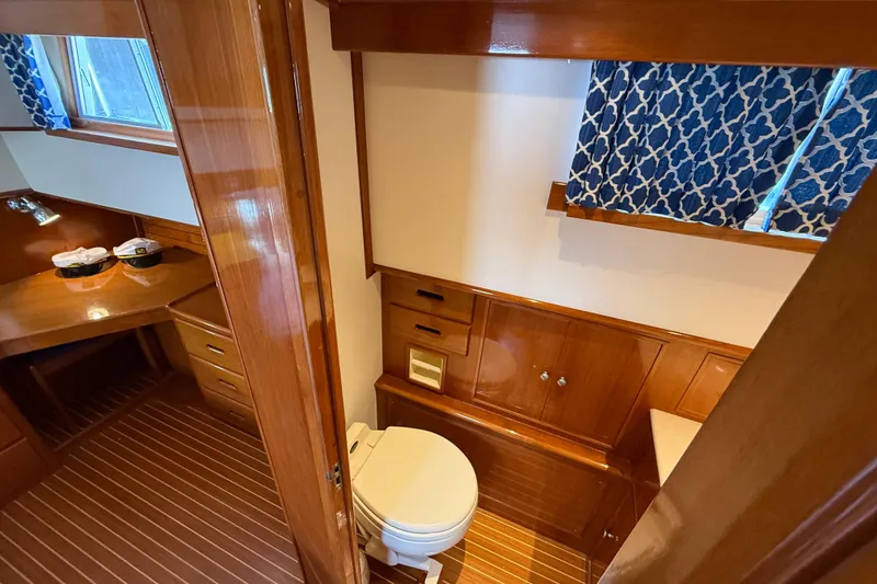 Slide: The Image of Luxurious wooden interior of 2002 Grand Banks 42 Classic yacht bathroom. - 41