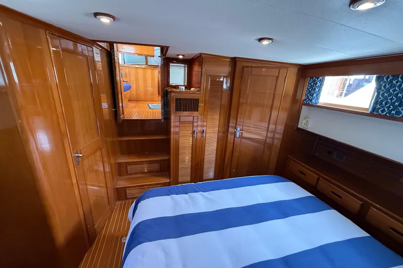 Slide: The Image of Luxurious cabin interior of 2002 Grand Banks 42 Classic yacht with wood finish. - 44