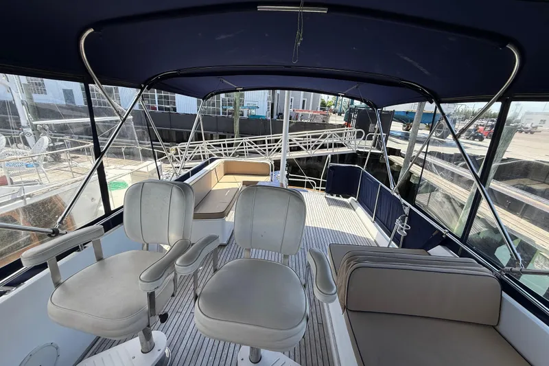 Slide: The Image of Flybridge of 2002 Grand Banks 42 Classic yacht with seating and canopy. - 51