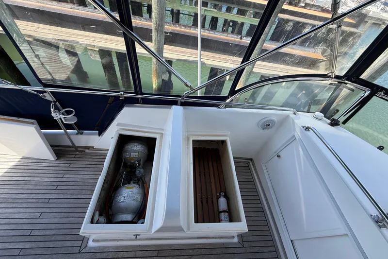 Slide: The Image of 2002 Grand Banks 42 Classic yacht deck with storage compartments and safety equipment. - 61