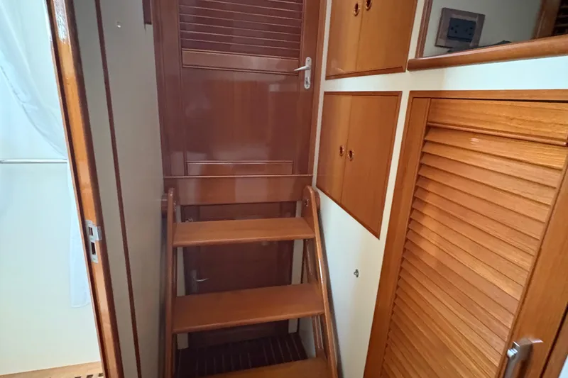 Slide: The Image of Interior of 2002 Grand Banks 42 Classic yacht with wooden stairs and cabinetry. - 67