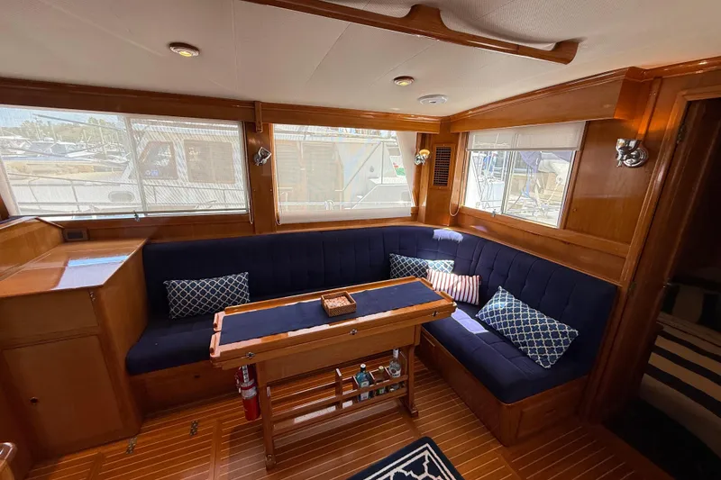 Slide: The Image of Interior of 2002 Grand Banks 42 Classic yacht with cozy seating and wooden accents. - 7