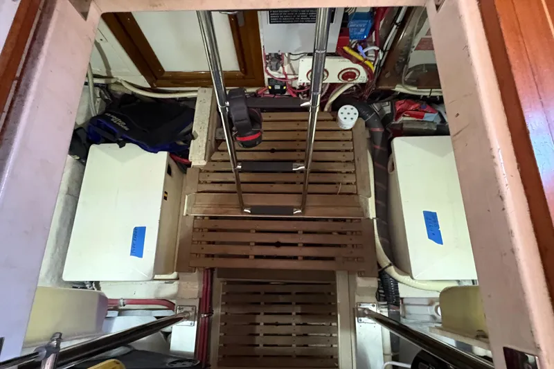 Slide: The Image of Engine room of a 2002 Grand Banks 42 Classic yacht with wooden flooring and equipment. - 70