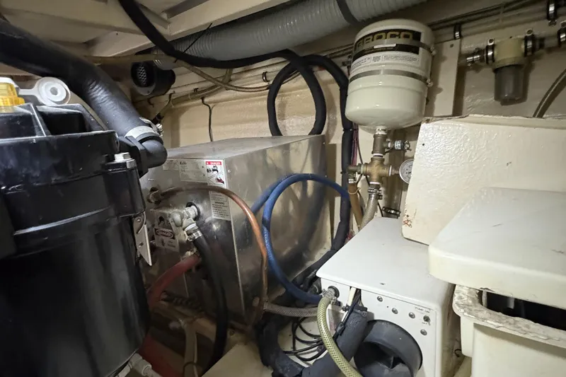 Slide: The Image of Engine room of 2002 Grand Banks 42 Classic yacht, showcasing mechanical components. - 72