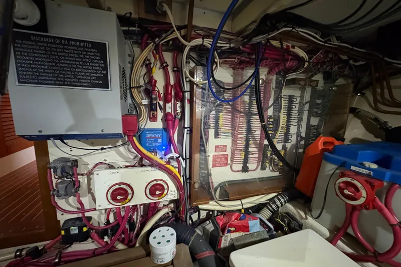 Slide: The Image of Engine room wiring and controls of a 2002 Grand Banks 42 Classic yacht. - 74