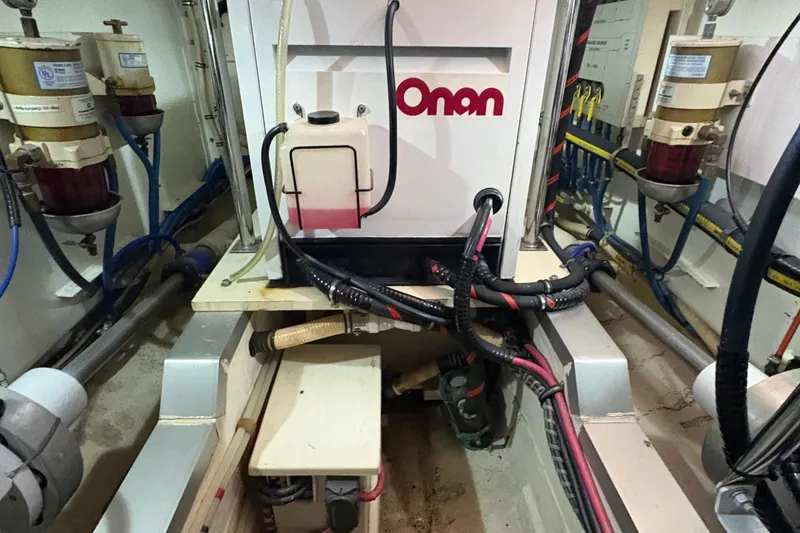 Slide: The Image of Engine room of 2002 Grand Banks 42 Classic with Onan generator and wiring. - 76