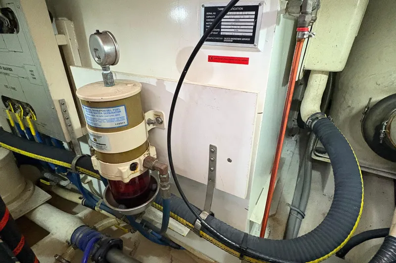 Slide: The Image of Engine room of 2002 Grand Banks 42 Classic with fuel water separator. - 79