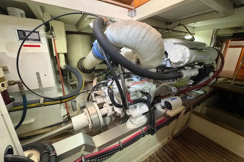 Slide: The Image of Engine room of 2002 Grand Banks 42 Classic yacht, showcasing detailed mechanical components. - 80