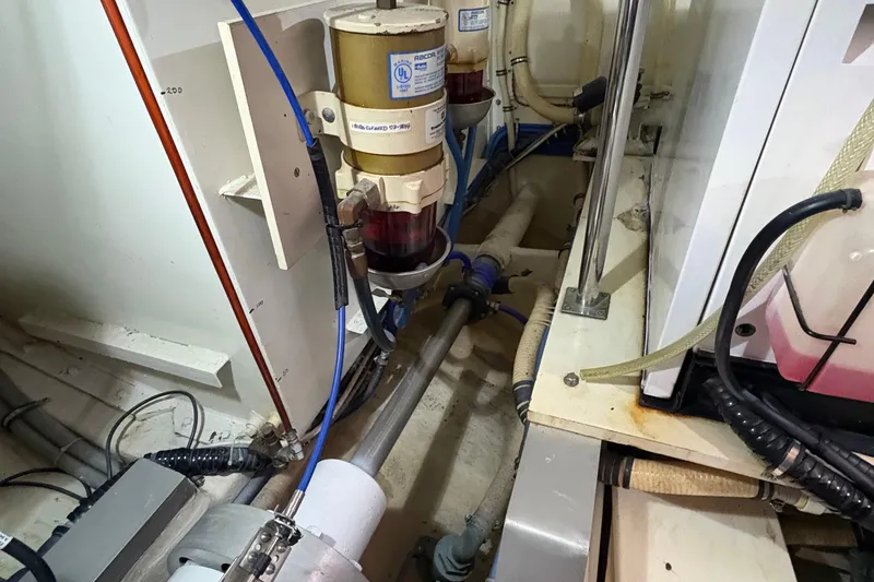 Slide: The Image of Engine room of a 2002 Grand Banks 42 Classic yacht, showcasing mechanical components. - 82