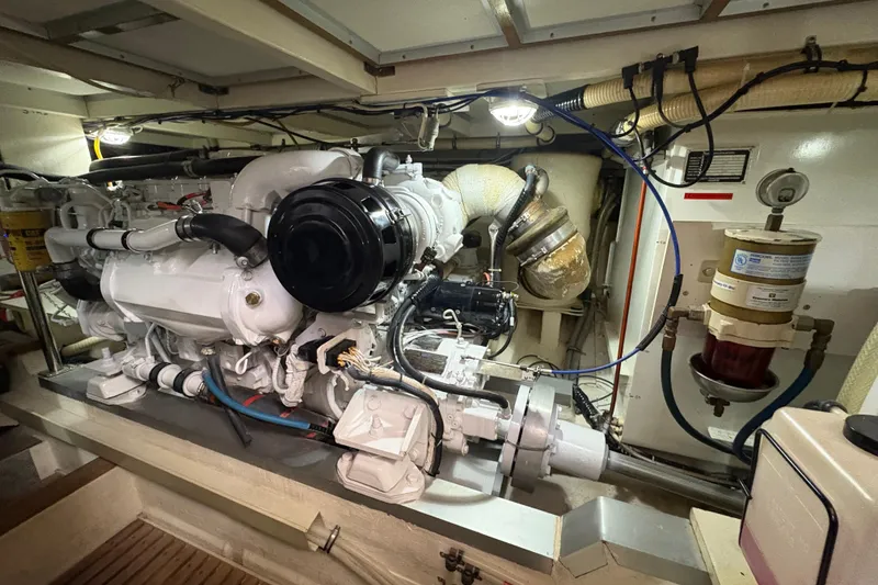 Slide: The Image of Engine room of 2002 Grand Banks 42 Classic yacht, showcasing detailed machinery and components. - 83