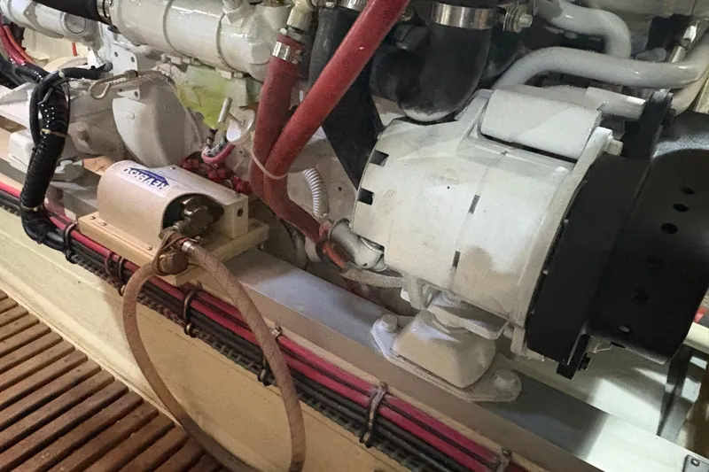 Slide: The Image of Engine room of 2002 Grand Banks 42 Classic yacht, showcasing mechanical components and wiring. - 84