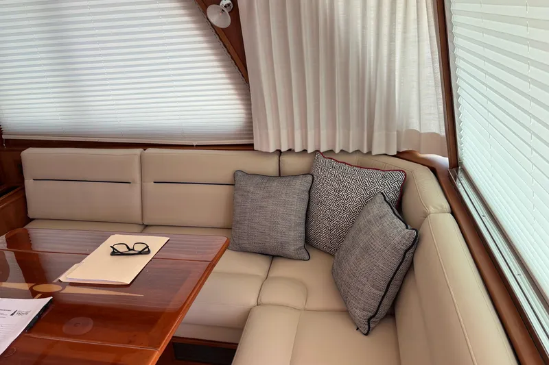 Slide: The Image of Luxurious interior of 2021 Sabre 48 Salon Express with plush seating and elegant decor. - 11