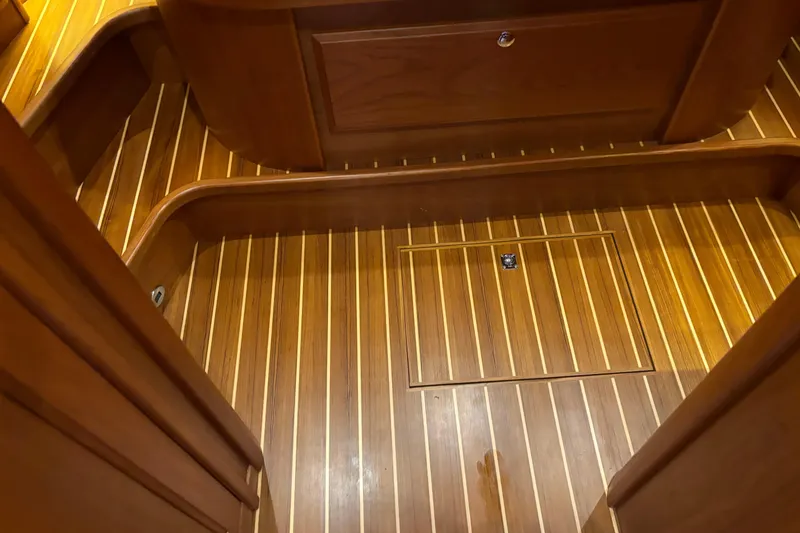 Slide: The Image of Teak flooring on 2021 Sabre 48 Salon Express yacht interior, featuring elegant wood finish. - 25