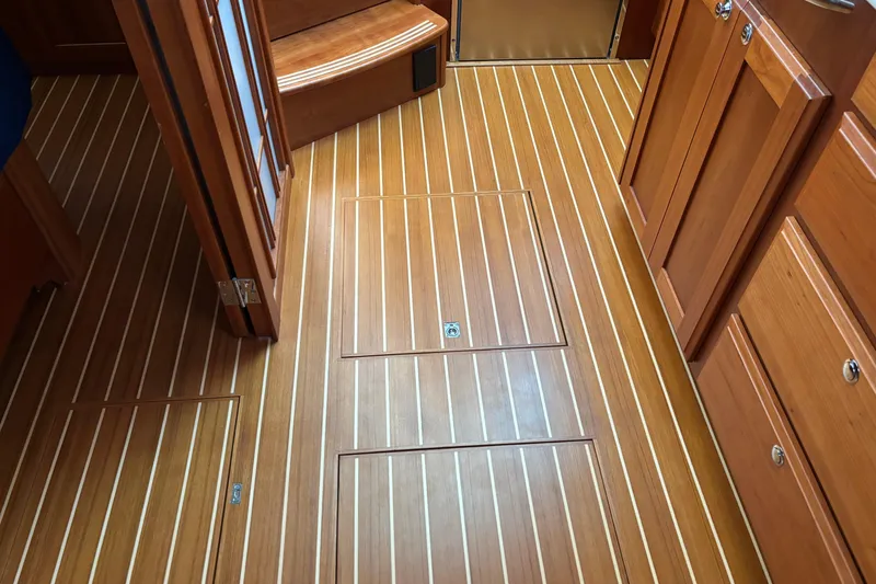 Slide: The Image of Interior of 2021 Sabre 48 Salon Express with elegant wooden flooring. - 27