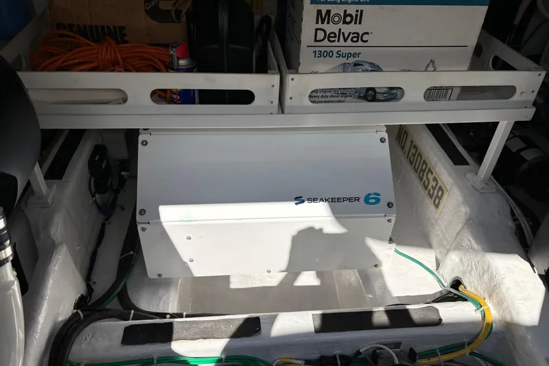 Slide: The Image of Engine room of 2021 Sabre 48 Salon Express with Seakeeper 6 stabilizer and Mobil Delvac oil. - 29