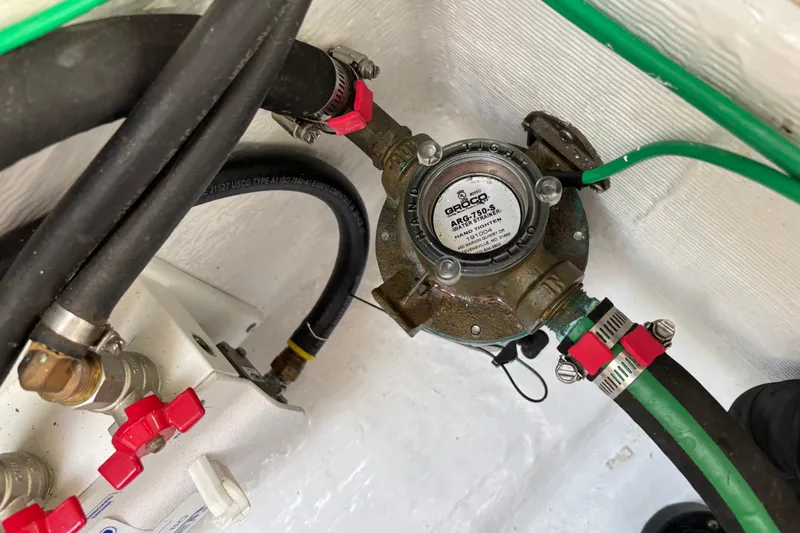 Slide: The Image of Engine compartment of 2021 Sabre 48 Salon Express with Groco ARG-1500-S strainer. - 34