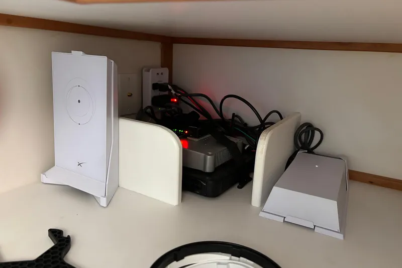 Slide: The Image of Starlink router setup inside 2021 Sabre 48 Salon Express yacht cabin. - 45