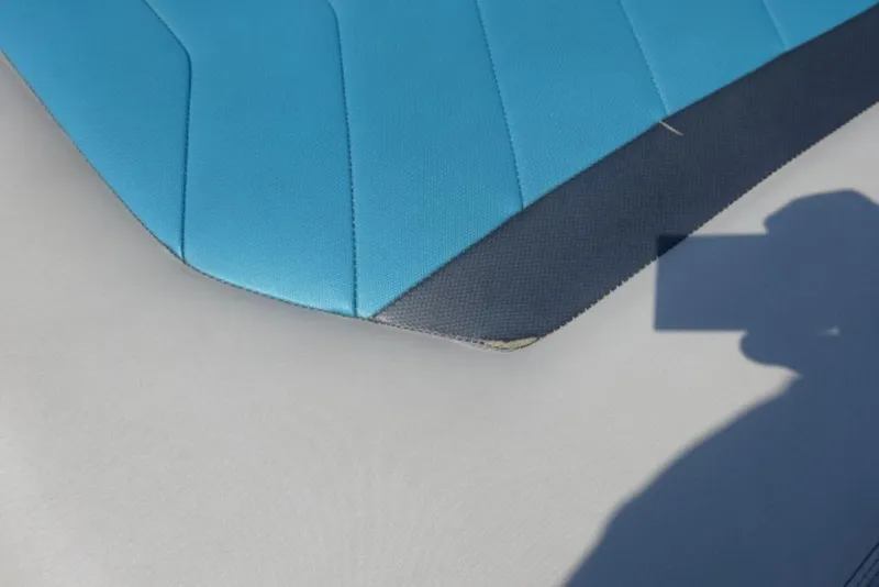 Slide: The Image of Blue and gray upholstery detail on 2016 Malibu 25 LSV boat seat. - 18