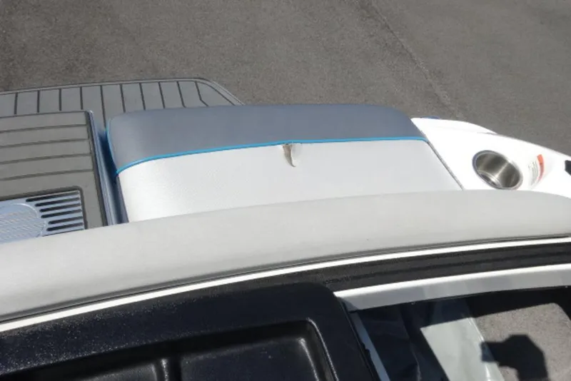 Slide: The Image of 2016 Malibu 25 LSV boat interior with seating and cup holder. - 20