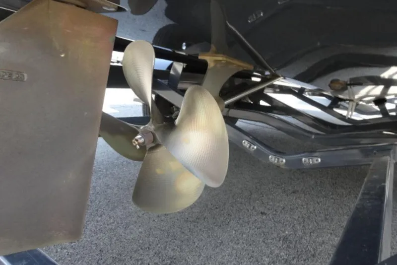 Slide: The Image of 2016 Malibu 25 LSV boat propeller and rudder detail. - 21