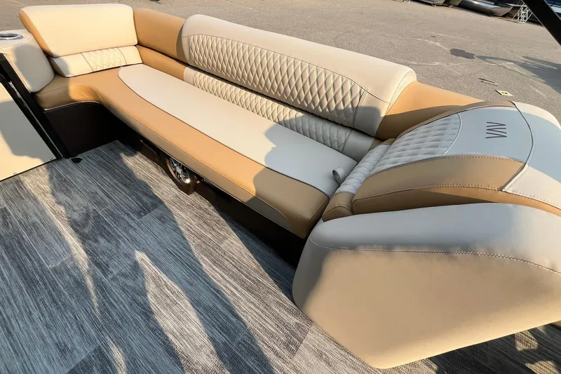 Slide: The Image of Luxurious seating on 2025 Avalon Catalina Quad Lounger, featuring elegant beige and tan upholstery. - 13