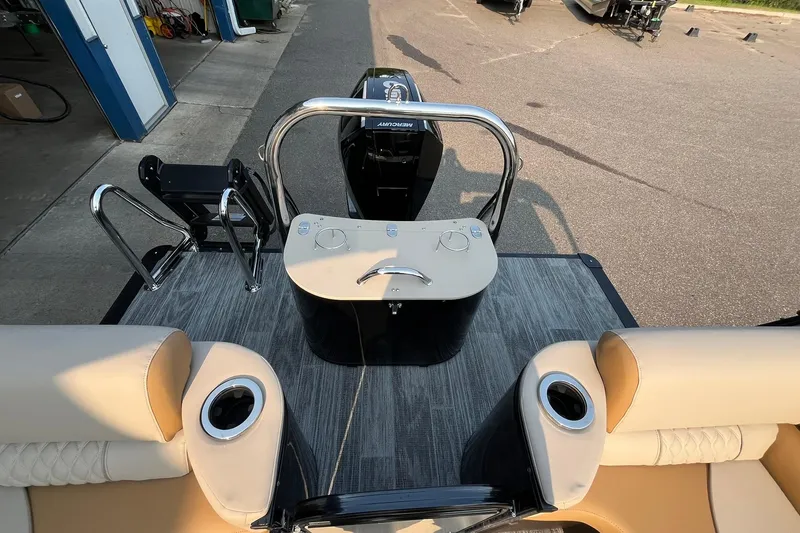 Slide: The Image of 2025 Avalon Catalina Quad Lounger boat interior with seating and control panel. - 14