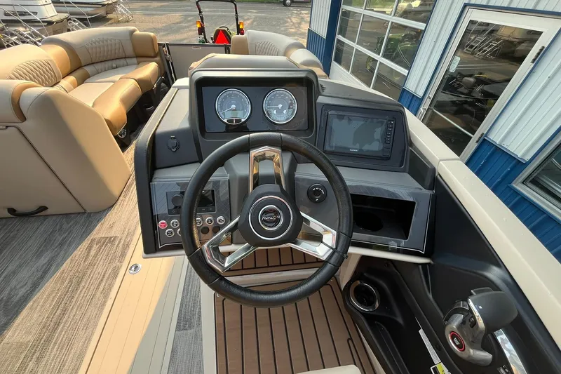 Slide: The Image of 2025 Avalon Catalina Quad Lounger dashboard with steering wheel and control panel. - 20