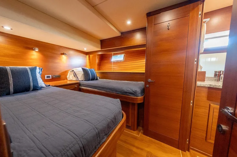 Slide: The Image of Luxurious 2016 Grand Banks 72 Aleutian RP yacht cabin with elegant wood finish. - 103