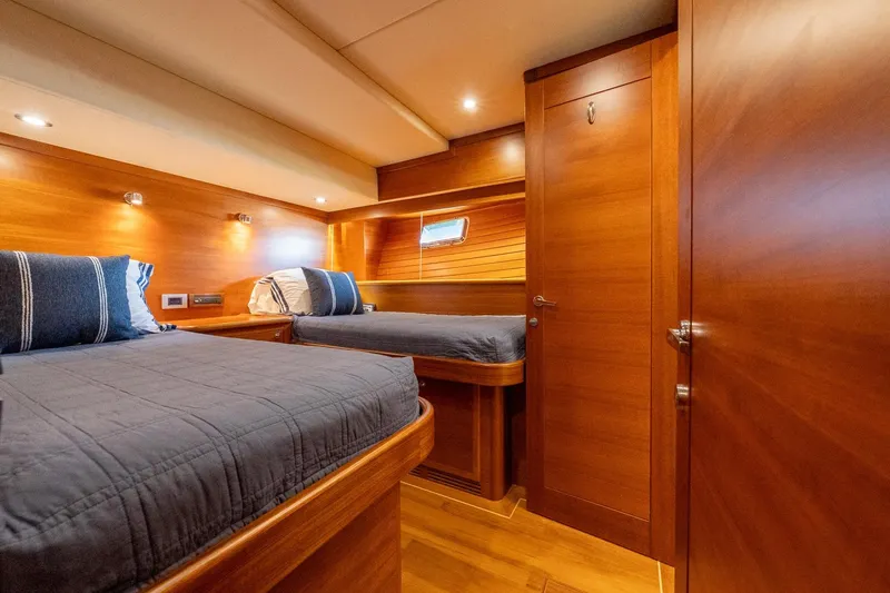 Slide: The Image of Luxurious cabin interior of 2016 Grand Banks 72 Aleutian RP yacht with wooden finishes. - 104
