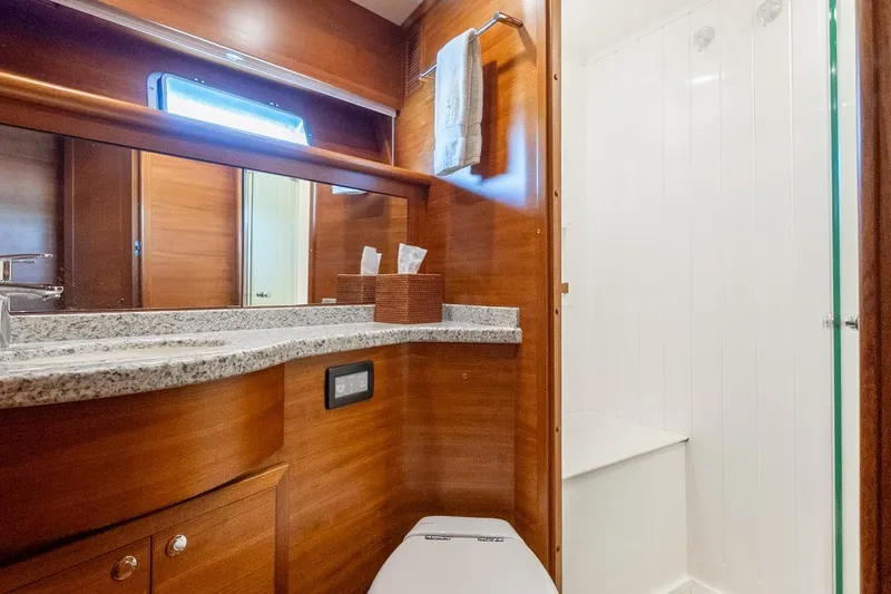 Slide: The Image of Luxurious bathroom in 2016 Grand Banks 72 Aleutian RP yacht with wood finish and modern amenities. - 106