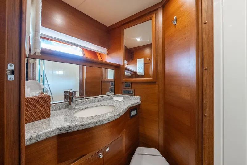 Slide: The Image of Luxurious bathroom in 2016 Grand Banks 72 Aleutian RP yacht with wood finish and granite countertop. - 113