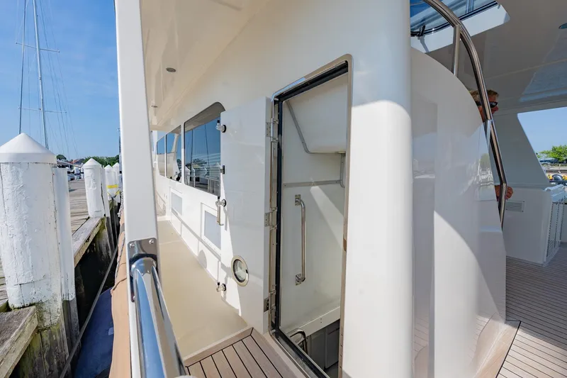 Slide: The Image of Luxurious bathroom in 2016 Grand Banks 72 Aleutian RP yacht with wood finish and granite countertop. - 114