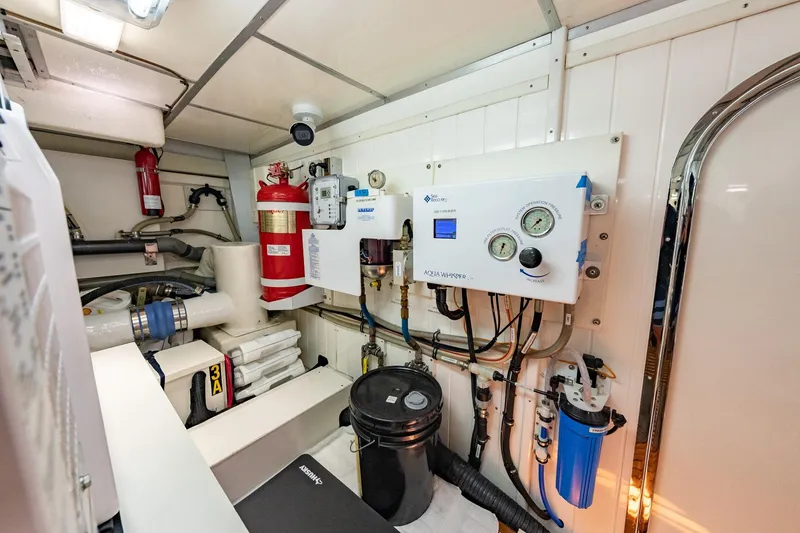 Slide: The Image of Engine room of 2016 Grand Banks 72 Aleutian RP yacht, featuring mechanical and electrical systems. - 123