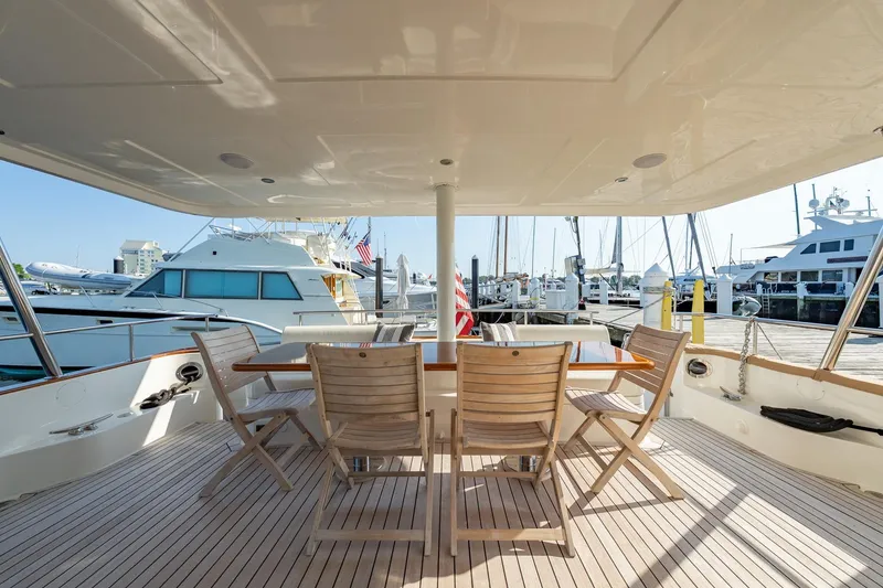 Slide: The Image of Luxurious 2016 Grand Banks 72 Aleutian RP yacht deck with seating and marina view. - 14