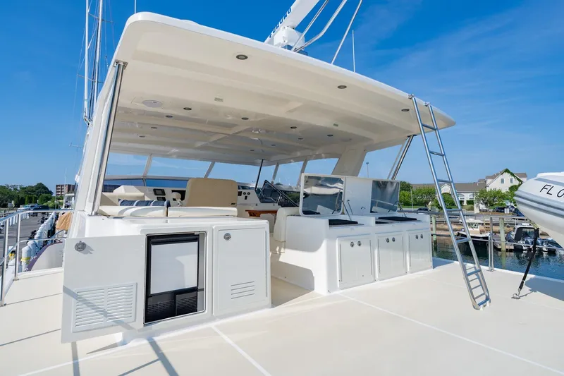 Slide: The Image of Docked 2016 Grand Banks 72 Aleutian RP yacht in a sunny marina setting. - 23