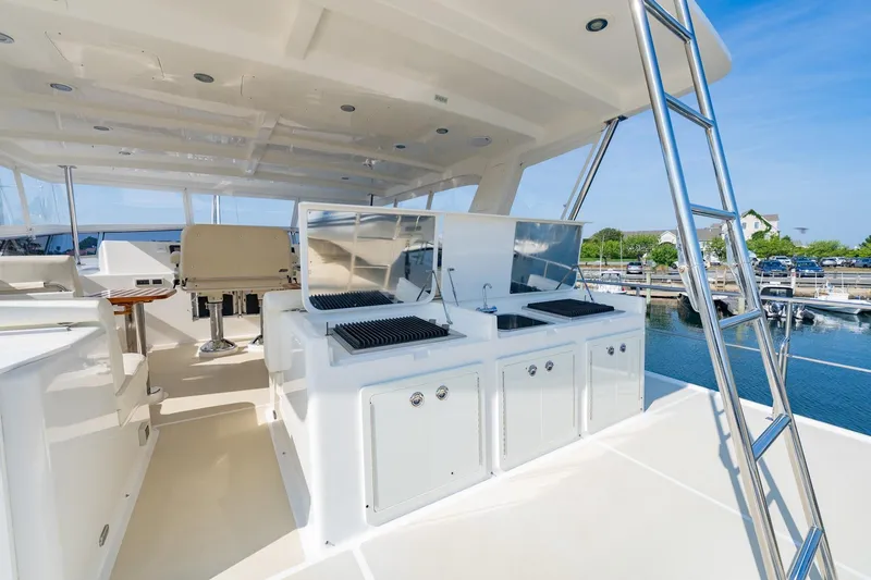 Slide: The Image of 2016 Grand Banks 72 Aleutian RP yacht deck with outdoor kitchen and ladder. - 25