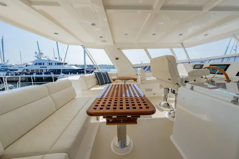 Slide: The Image of Luxurious interior of 2016 Grand Banks 72 Aleutian RP yacht with plush seating and tables. - 31